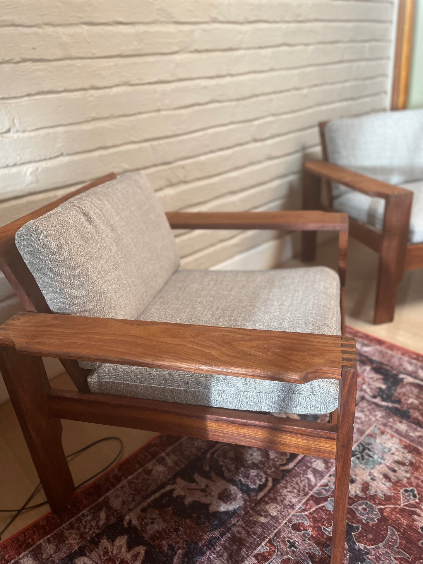 A pair of Kiaat armchairs, inspired by the iconic Kallenbach